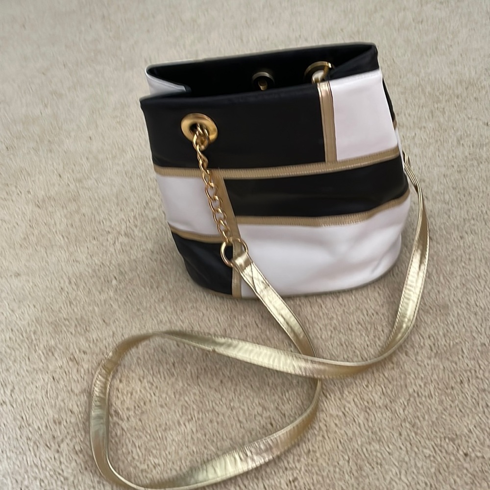 Cross body black, white and gold bag